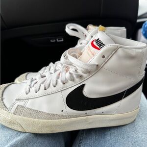Nike White High-Top Sneakers with Black Swoosh